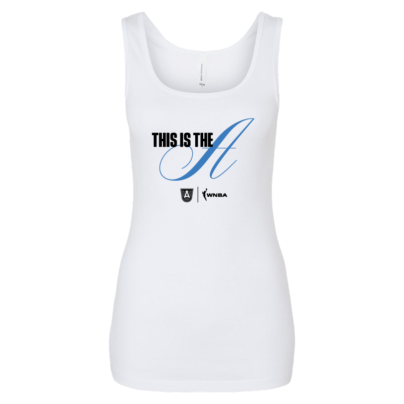 White slim-fit tank top from the Designed by Atlanta Dream collection, featuring the graphic "THIS IS THE A" in bold black and blue lettering across the chest. The tank has a square neckline and the WNBA and Atlanta Dream logos on the lower left side. Made from a soft blend of 52/48 Airlume combed and ring-spun cotton/polyester fabric.